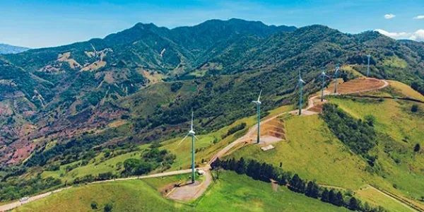 aerial view of windmills on hill